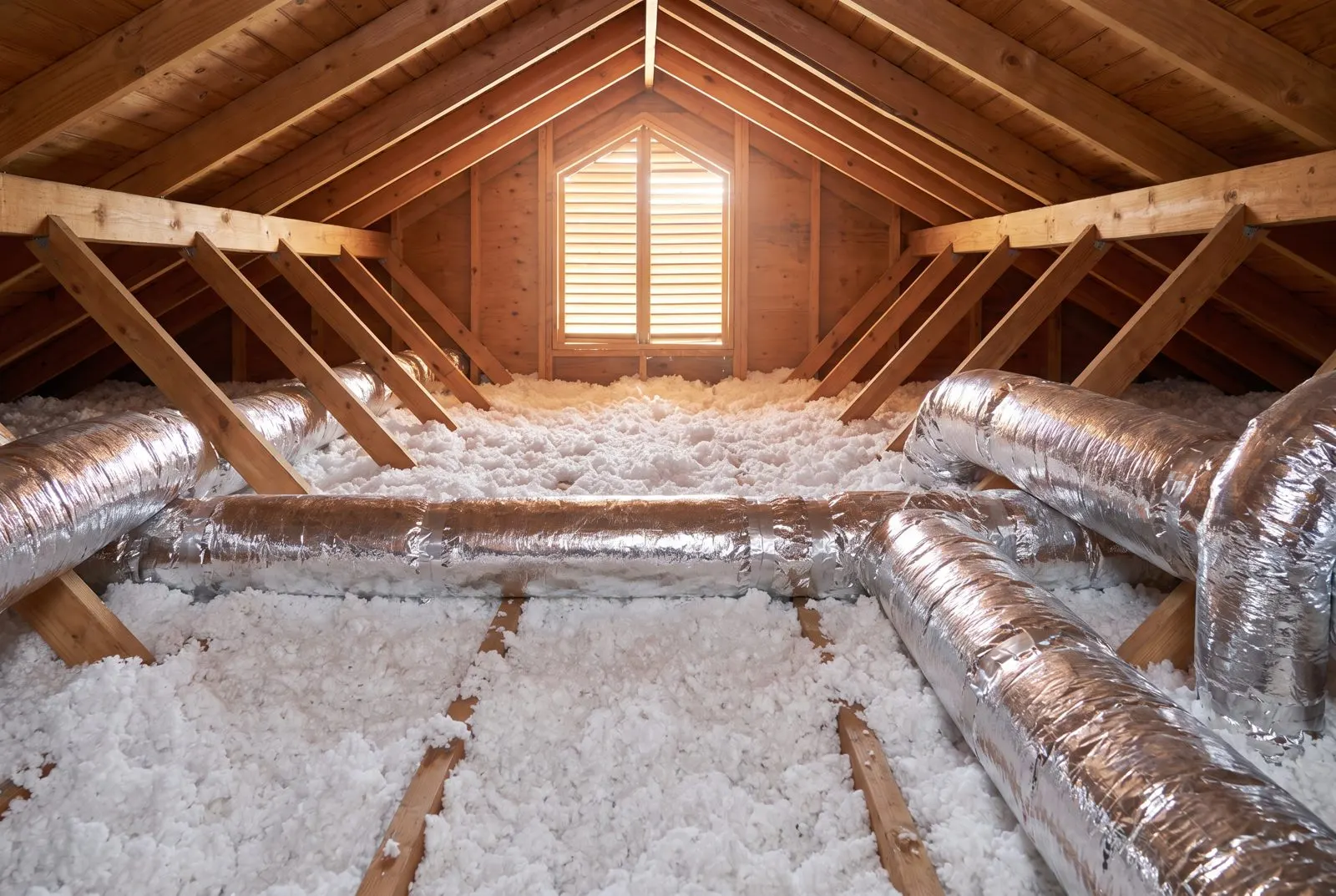 Attic with deep blown-in insulation and sealed ducts