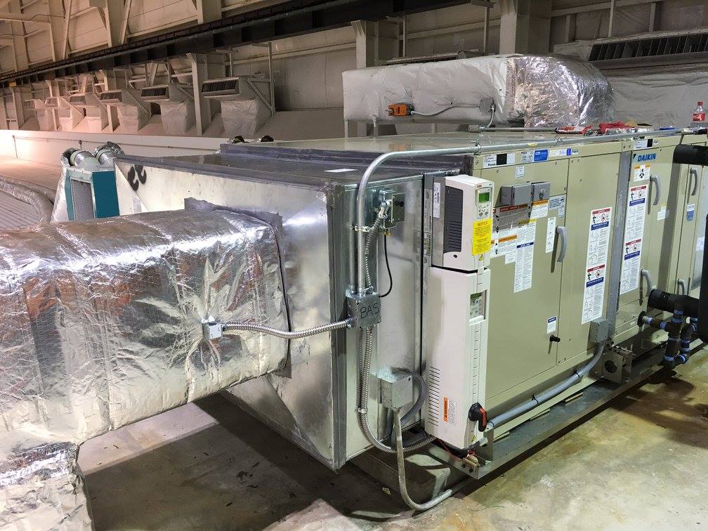 Finished install showing controls, BAS panel, and ductwork insulation