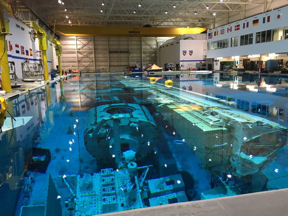 NASA Neutral Buoyancy Laboratory training pool with submerged ISS modules
